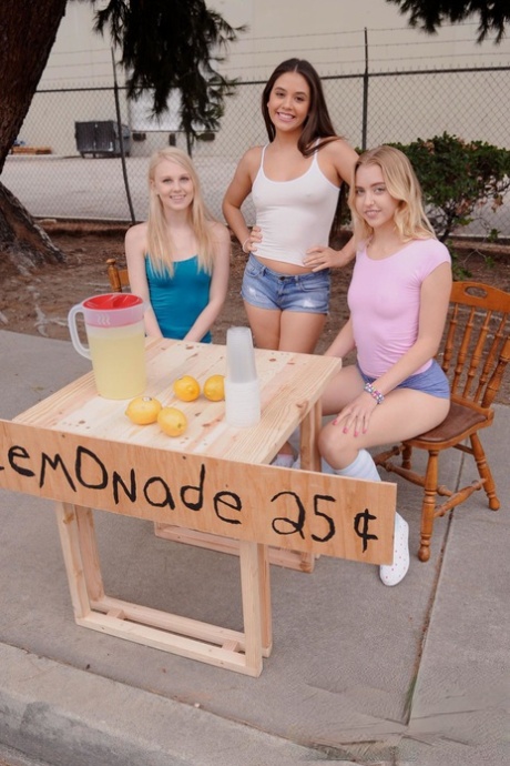 Naughty schoolgirls give their lemonande customer a handjob in public