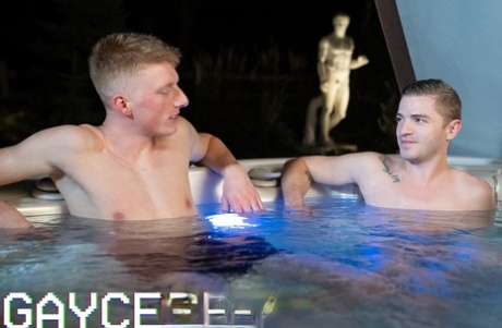 Two hunky young twinks and two horny DILFs enjoy a foursome in a jacuzzi