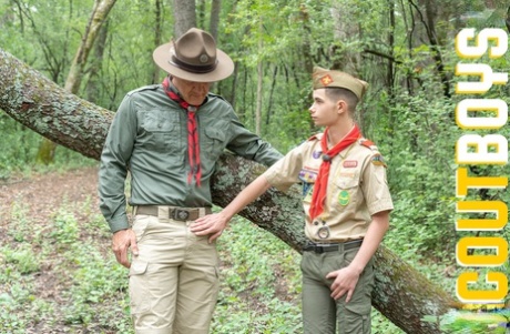 Mature gay scoutmaster Maxwell strips a twink and fucks him while out hiking