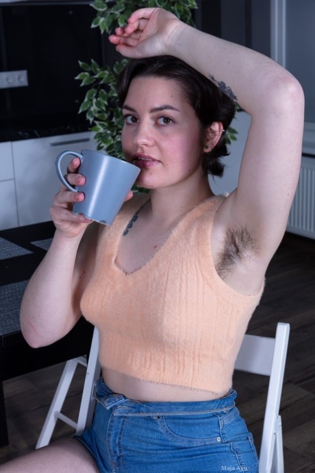 Hot amateur Maja Aguilar exposes her bushy armpits and twat in a solo