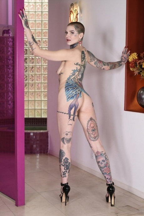 Short haired inked babe Titi Ramone poses naked before getting fucks anally