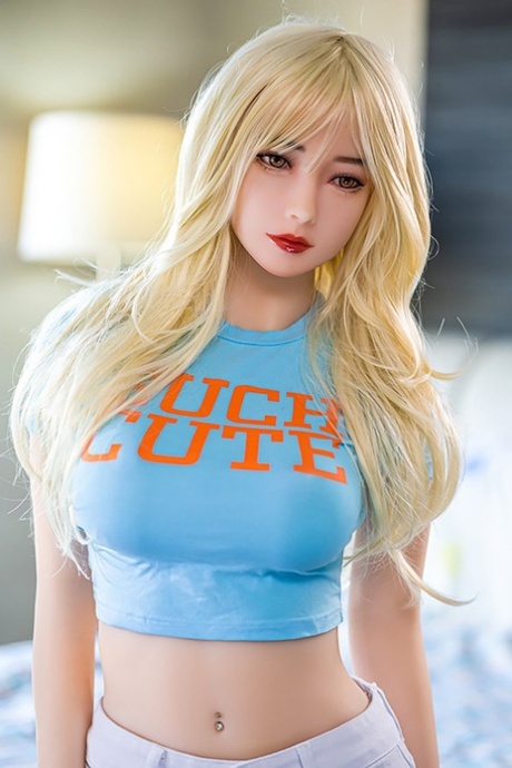 Adorable blonde sex doll Alice showing off her big tits and firm booty